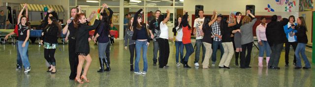 teaching students in salsa, tango, lindy, Ballroom & Latin dancing